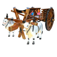 Close-up of handcrafted teak wood bullock cart teapoy showing natural grain and hand-carved detailing